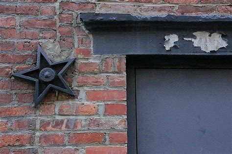 what do the metal stars on houses mean|cast iron stars on buildings.